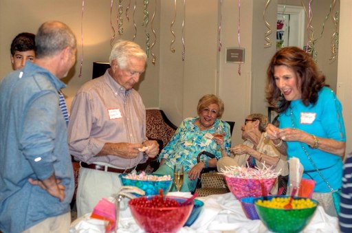 Volunteers enjoy desserts provided at the party