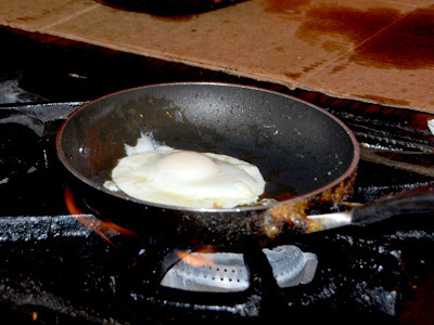 Egg is cooked in a hot buttered skilled